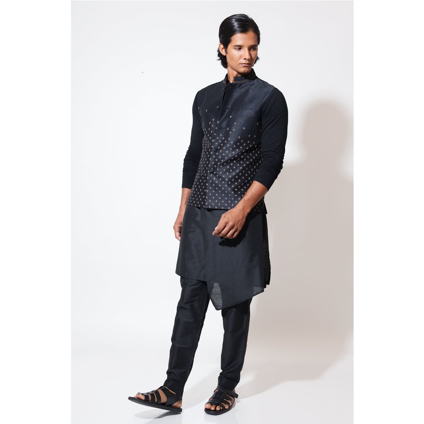 Sleeveless bandi with double tone star embroidery layered over assymetric hem kurta