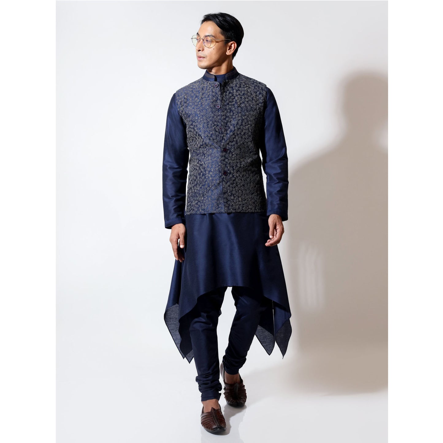 Sleeveless bandi with tonal couching embroidery layered over handkerchief hem kurta