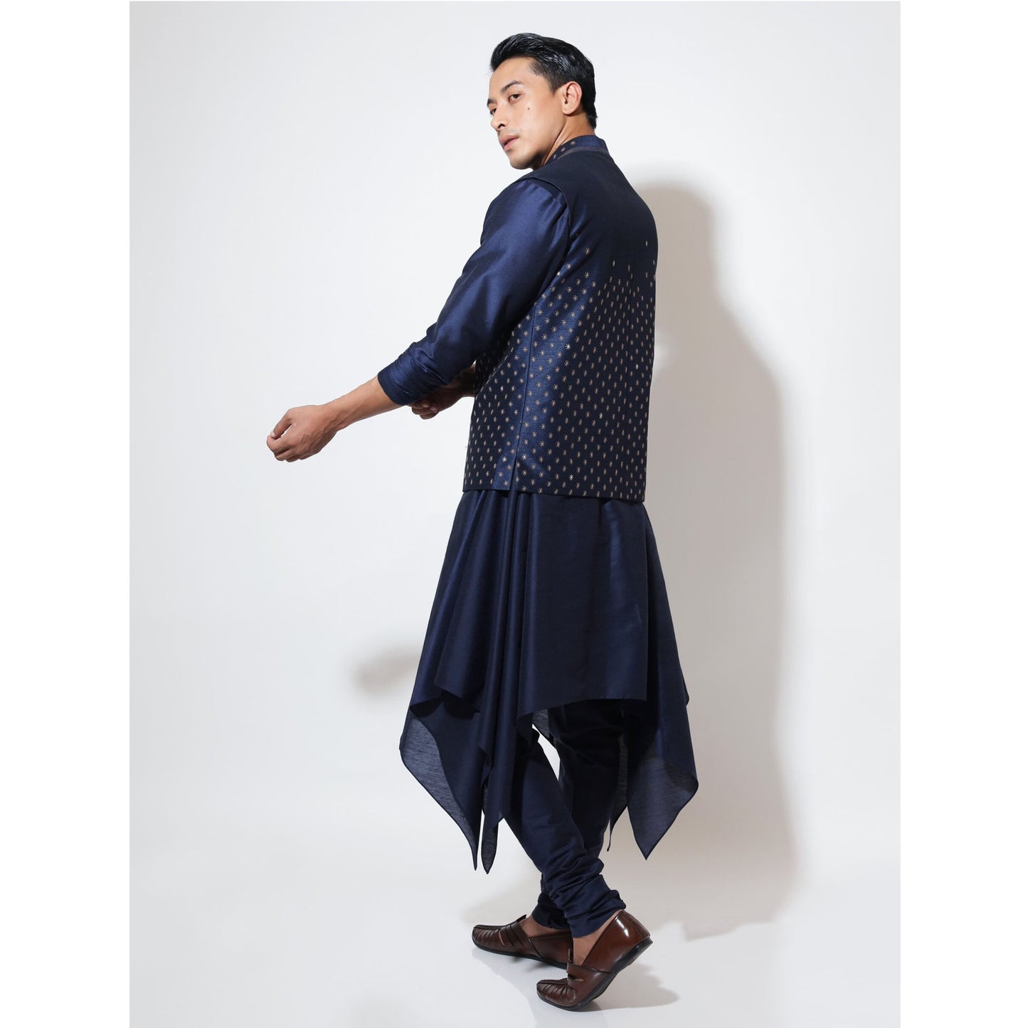 Sleeveless bandi with double tone star embroidery layered over handkerchief hem kurta