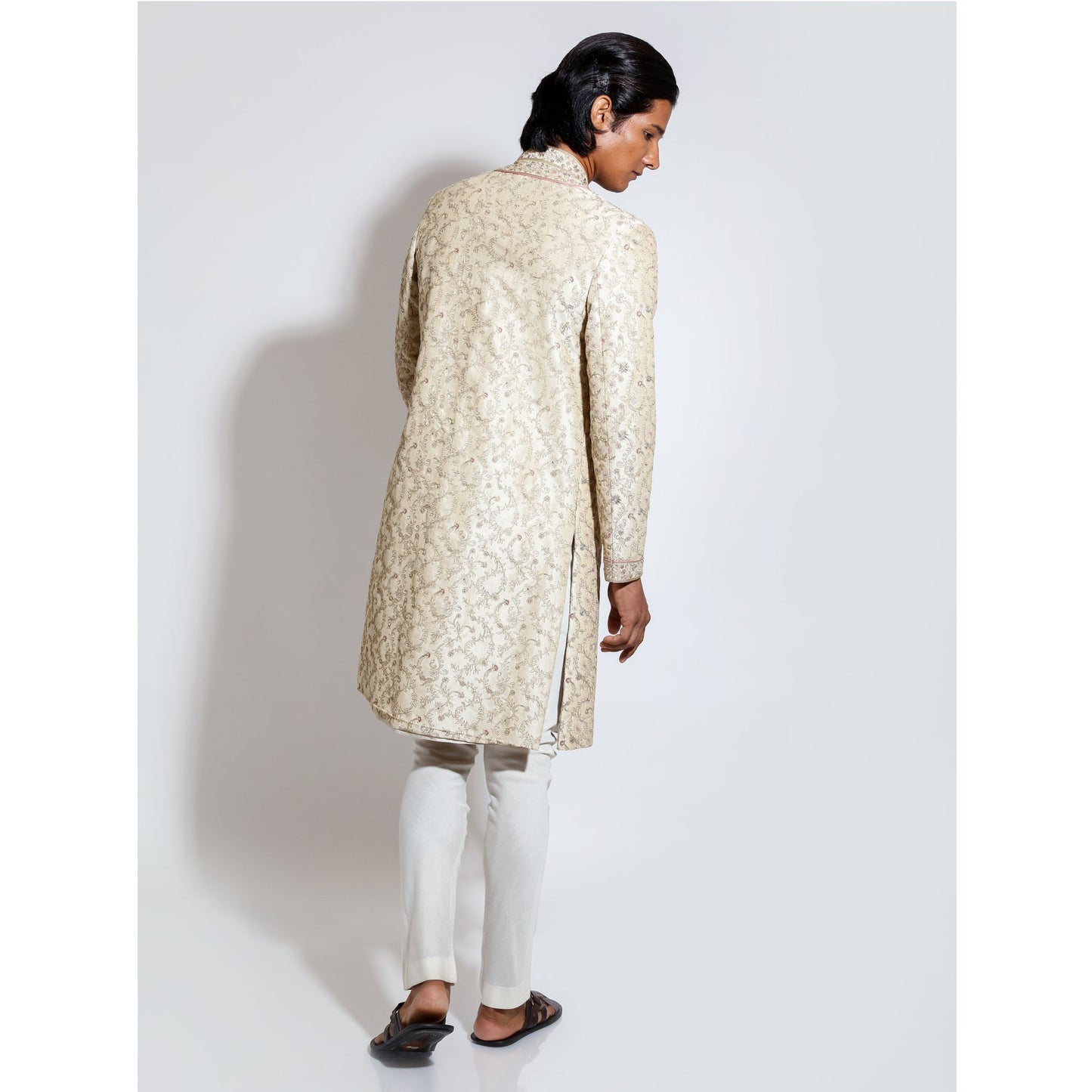 Sherwani with all over emb and layered front with border with cropped pants
