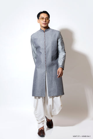 Linear creeper embroidered sherwani with contrast potli buttons layered over dhoti pants