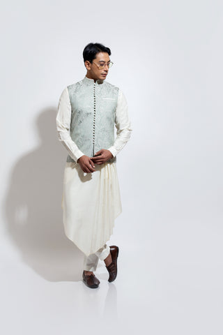 Paisley jacquard bandi with potli buttons layered over pleated assymetric hem kurta