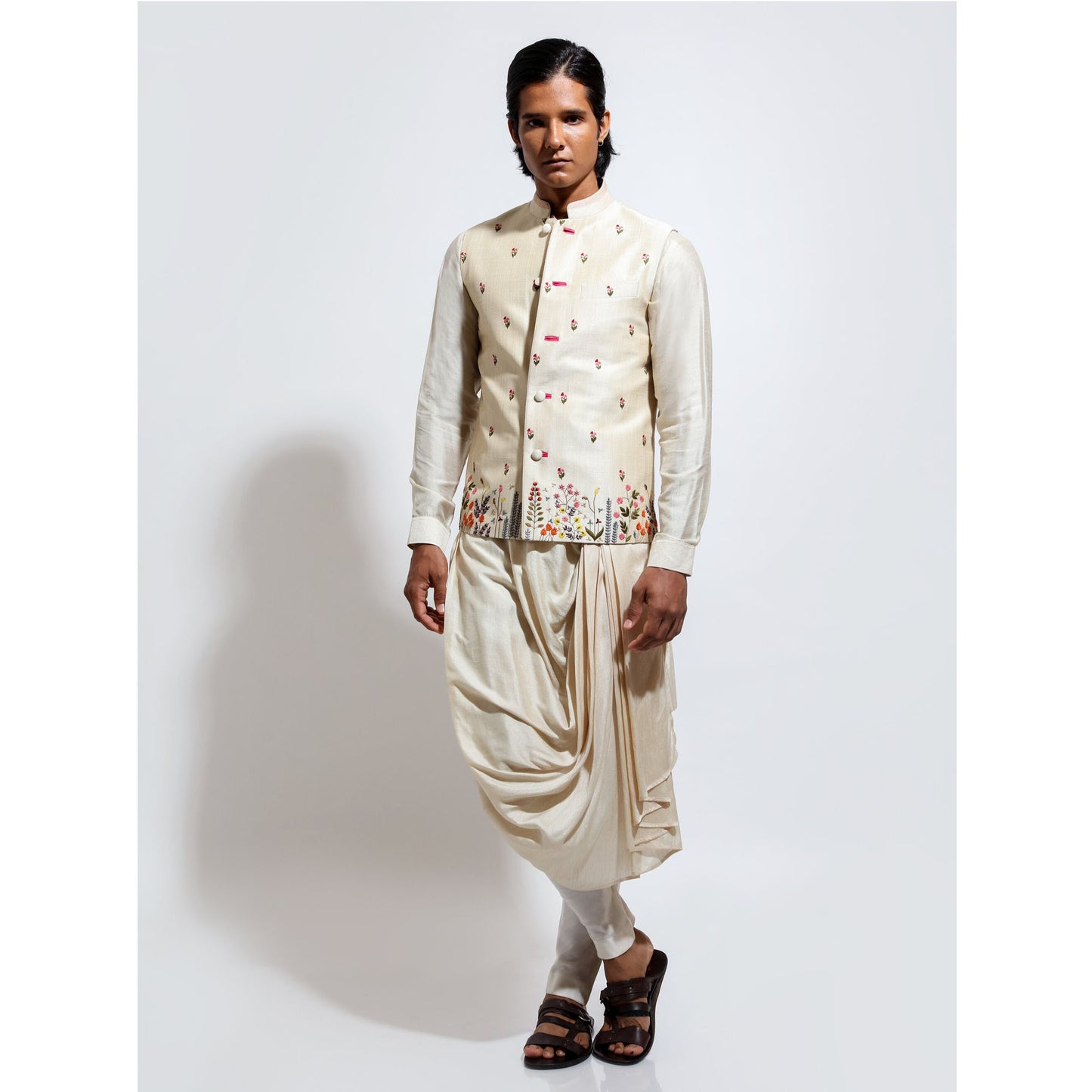 Sleeveless bandi with multicolor floral embroidery layered over cowl kurta