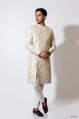 Off centre open sherwani with 2 tone motif embroidery & potli buttons layered over crop pants