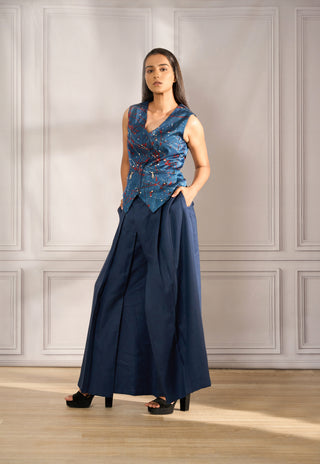 Splash print satin waistcoat with zipper detail paired with pleated pallazo in navy linen