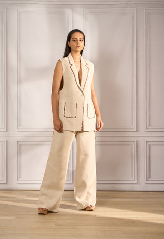 Stylized waistcoat in beige linen with handpainted edging