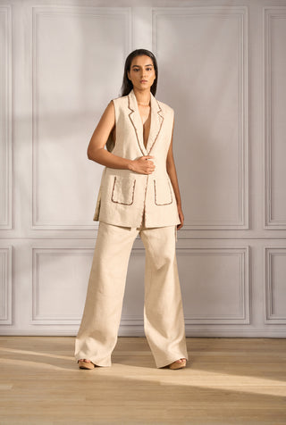 Stylized waistcoat in beige linen with handpainted edging