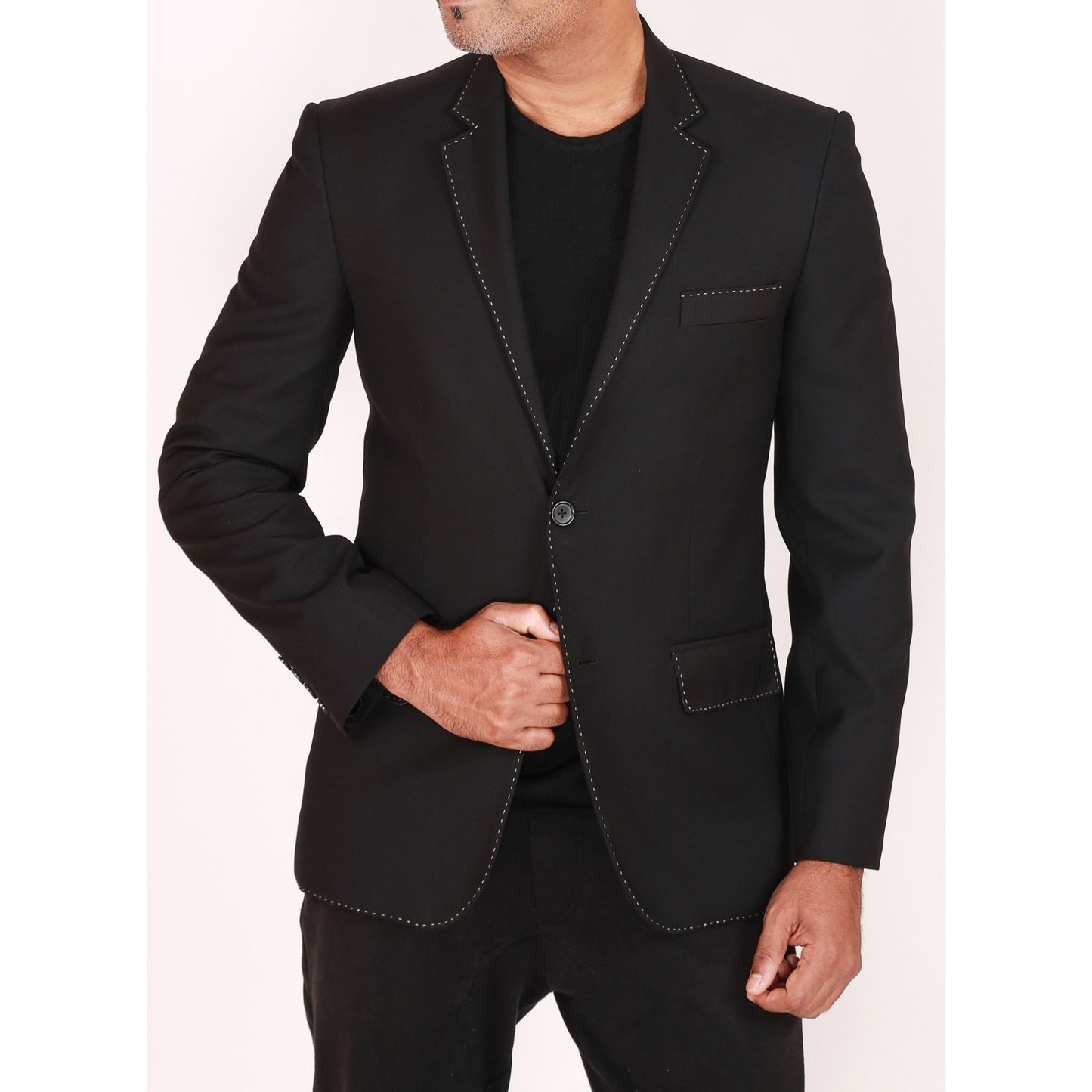 Single breasted jacket with handstitch detail at edges & slimfit flatfront trousers