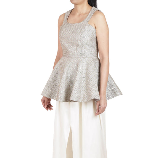 Embroidered peplum top in champagne